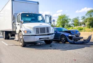 car damage after an accident with a semi truck