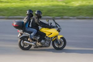motorcycle rider with a passenger