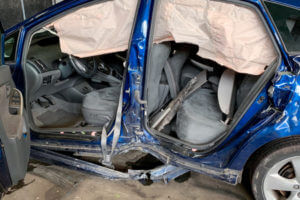 damaged car following a t bone accident