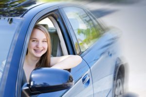 teenager driving a car