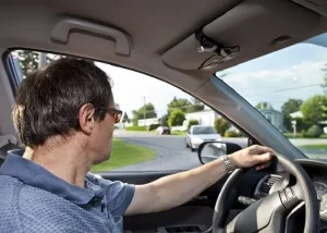 man practicing defensive driving