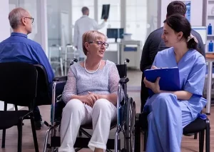 disabled patient speaking with a nurse