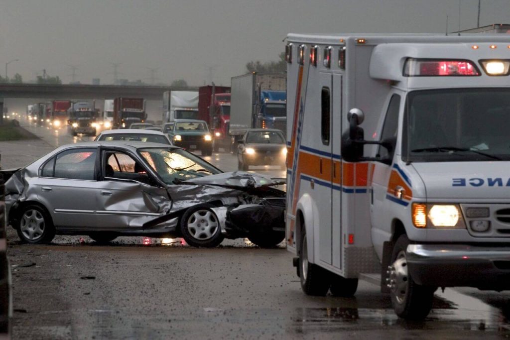 EMT's offering assistance to car accident victim