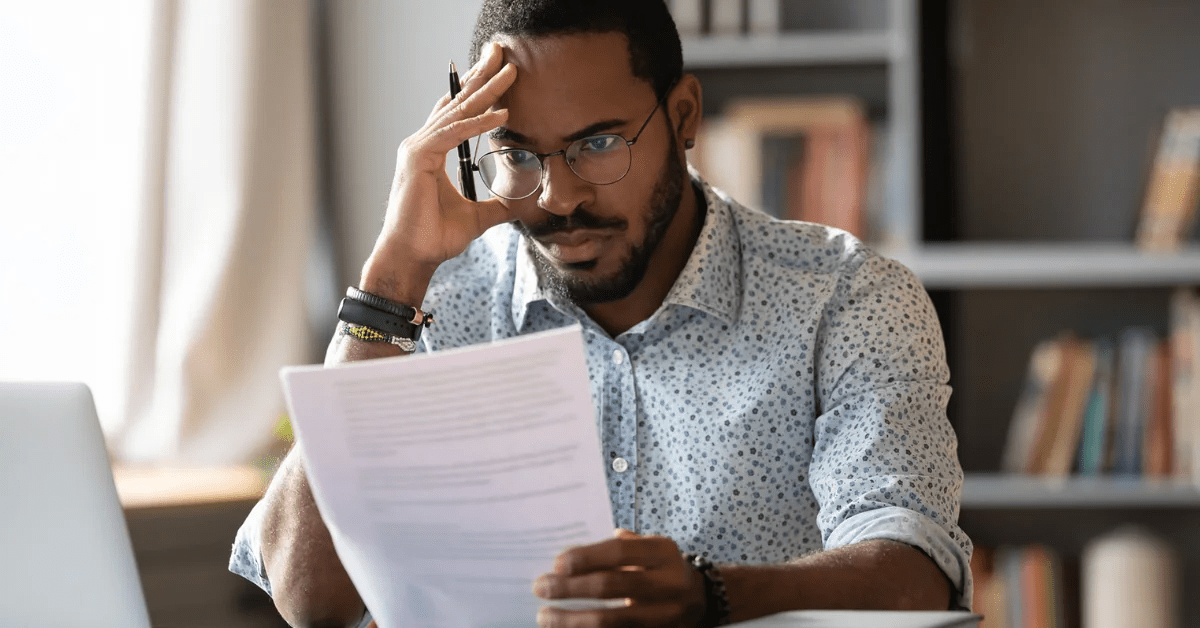 Man overwhelmed with student loan debt